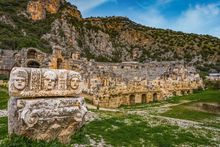 Stone theater faces and masks in Myra Ancient City. Ancient Myra Theater in background. Demre, Antalyaの写真素材