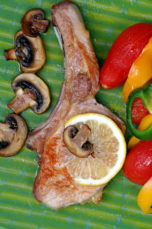 A pork meat and vegetables on the plate