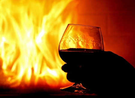 Fire in the fireplace,wood and cognac