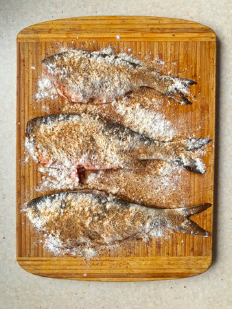 fresh fish on a wooden boardの写真素材