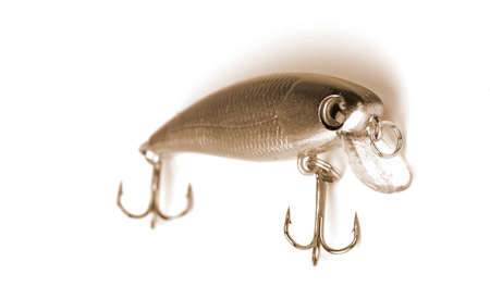 a fishing spoon-bait on white background