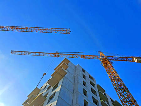 construction site with crane in sunny day