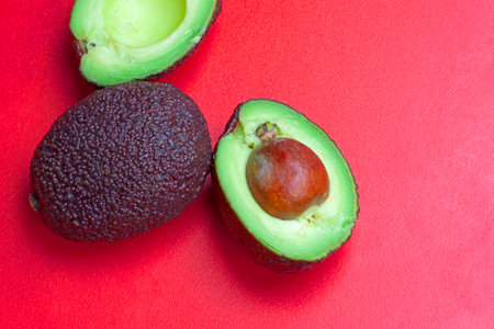 an avocado on a red plateの写真素材