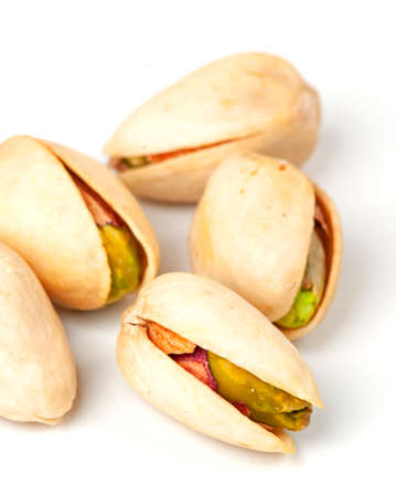pistachio nuts isolated on whiteの写真素材