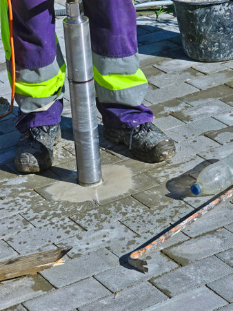 Worker drills with a special tool. Close-upの写真素材
