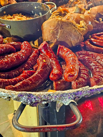Assortment of sausages on a barbecue in a restaurant.の写真素材
