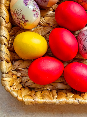 Colorful easter eggs in a basket on a white background.