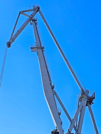 Crane against the blue sky, close-up. industrial backgroundの写真素材
