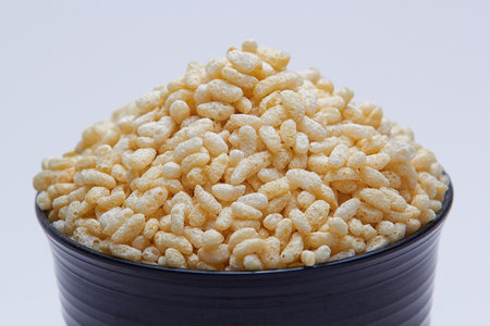 a bowl of towering rice crispy, on isolated white backgroundの写真素材