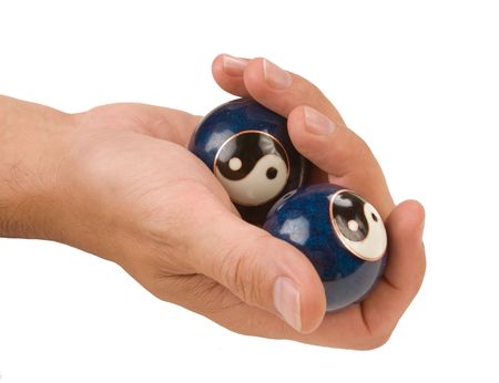 hand holds a ball isolated on white backgroundの写真素材