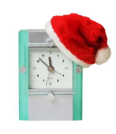 clock in the hat of Santa Claus isolated on whiteの写真素材