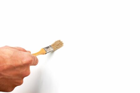 hand holds the brush to drawの写真素材