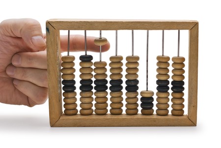 hand and a wooden Abacus isolatedの写真素材