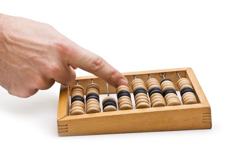 hand and a wooden Abacus isolatedの写真素材