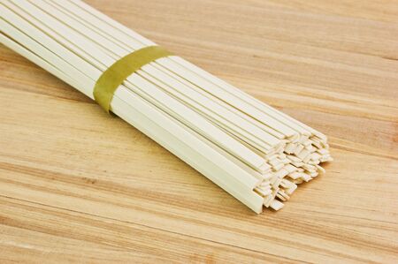 Japanese noodles on wooden plateの写真素材