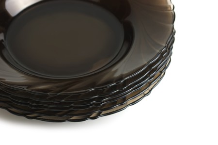 stack of brown plates isolated on a white backgroundの写真素材
