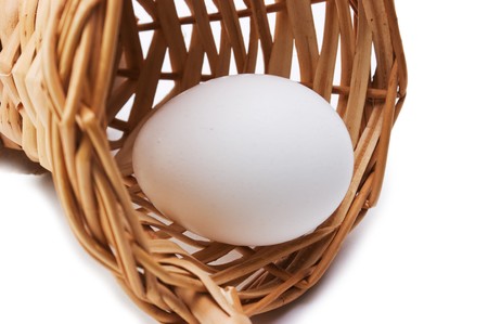 eggs in a basket isolated on a white backgroundの写真素材