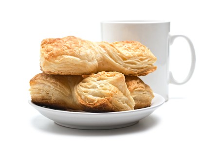 cookies on a plate and cup isolated on a white backgroundの写真素材