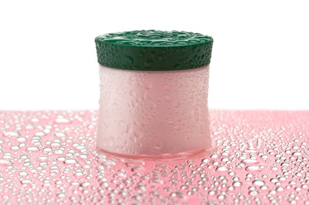 cosmetic cream jar wet isolated on a white background