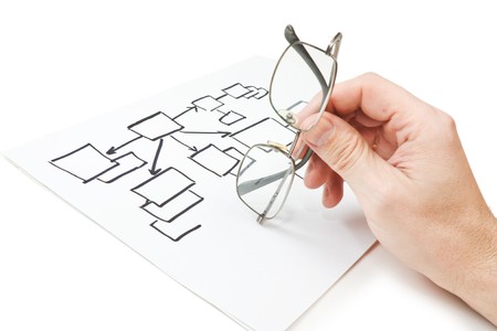 hand holds glasses and the block diagram  isolated on a white background