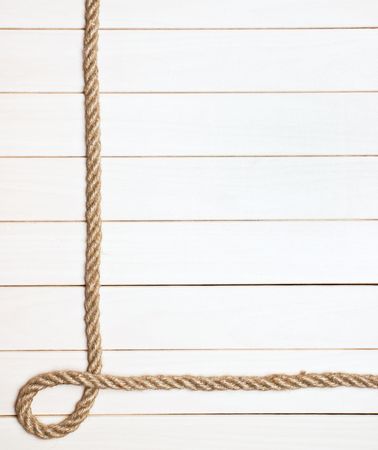 Photo Frame from the rope against the wooden boardsの写真素材