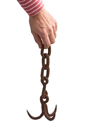 hand holds the old anchor on a chain  isolated on a white backgroundの写真素材