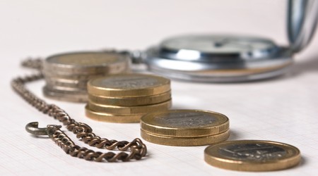 old pocket watches and coinsの写真素材