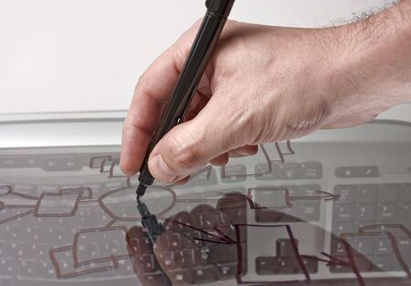 hand draws a block diagram on a transparent glassの写真素材