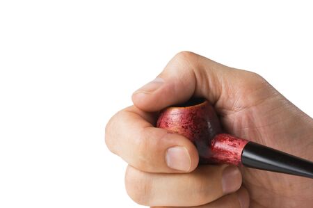 tobacco pipe  in hand isolated on white backgroundの写真素材