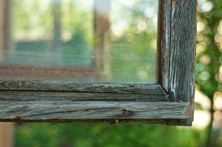 old wooden windows open in a village houseの写真素材