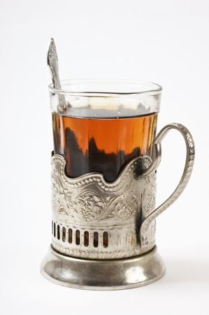 glass of tea in a silver cupの写真素材