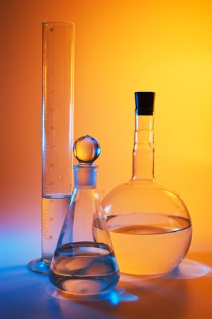 chemical glassware in multicolored lightsの写真素材