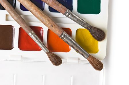 watercolor paints and art brushes  isolated on a white backgroundの写真素材