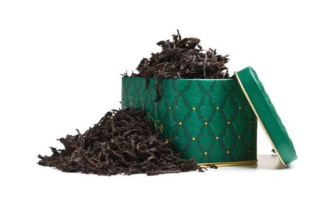 dry tea leaves in a box  isolated on a white backgroundの写真素材