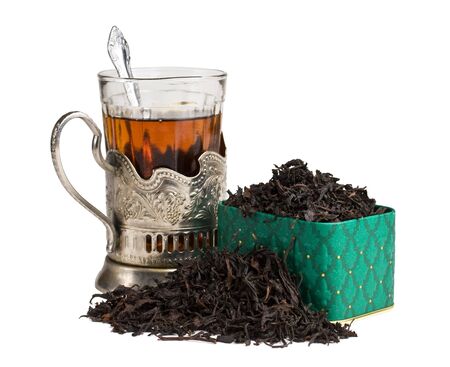 dry tea leaves in a box and glassの写真素材