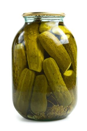 Glass jar of preserved gherkins isolated on whiteの写真素材