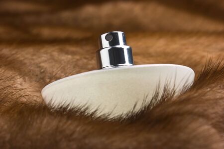 bottle of perfume on a mink coatの写真素材