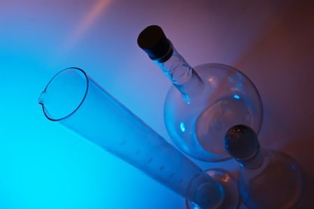 chemical glassware in multicolored lightsの写真素材