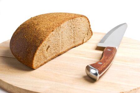 sliced bread and the knife on the board isolated