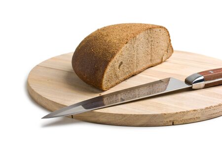 sliced bread and the knife on the board isolatedの写真素材