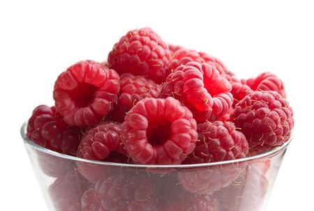 berries raspberries in a wineglass  isolated on white