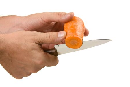 Cutting carrots  isolated on white backgroundの写真素材