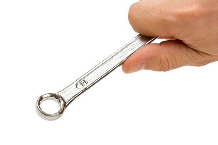 spanner in hand isolated on white backgroundの写真素材
