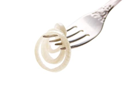 slice onions on a fork isolated on white backgroundの写真素材