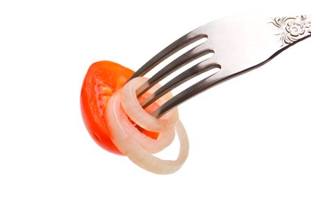 slice tomatoes on a fork isolated on white backgroundの写真素材