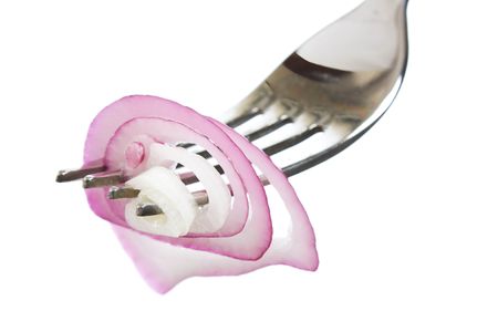 onions on a fork isolated on white backgroundの写真素材