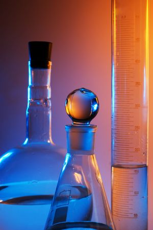 chemical glassware in multicolored lightsの写真素材