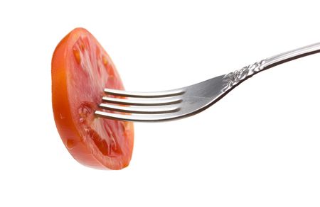 slice tomatoes on a fork isolated on white backgroundの写真素材