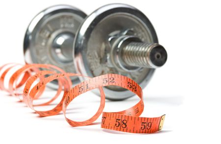 dumbbell and measuring tape. isolated on white の写真素材