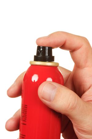 red spray bottle in his hand  isolated on a white  backgroundの写真素材
